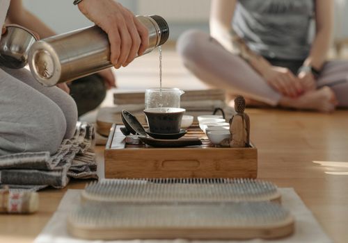Close-up of hands in a meditative pose, symbolizing focus and simplicity.